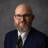 Justin P. Enecks